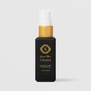 Sorella Apothecary Spiced Wine Toner 1 fl oz in a black pump bottle with gold collar on a light gray background
