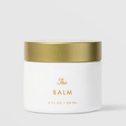 Sorella Apothecary The Balm Moisturizer (2 fl oz / 59 ml) in a white matte jar with a gold lid and gold lettering, displayed against a light gray background.