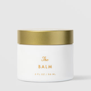 Sorella Apothecary The Balm Moisturizer (2 fl oz / 59 ml) in a white matte jar with a gold lid and gold lettering, displayed against a light gray background.