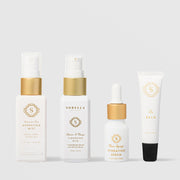 Sorella Apothecary Healthy Aging Kit featuring four travel-size products: Watermelon Mint Hydrating Mist, Apricot and Mango Cleansing Milk, Main Squeeze Hydrating Serum, and The Balm
