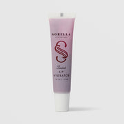 Sorella Apothecary Tinted Avocado Oil Lip Hydrator 0.25 oz in a pink to purple gradient tube with white cap on a light gray background