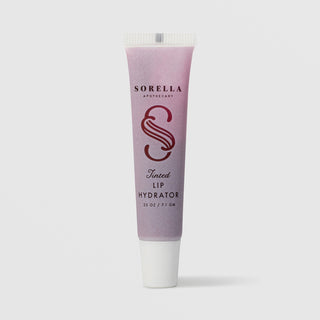 Sorella Apothecary Tinted Avocado Oil Lip Hydrator 0.25 oz in a pink to purple gradient tube with white cap on a light gray background