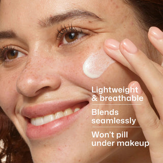 Woman applying EltaMD UV Clear SPF 50 to cheek – lightweight breathable sunscreen that blends seamlessly for acne-prone skin