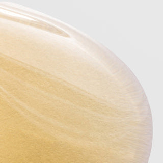 Close-up of Circadia Vitamin Veil Cleansing Oil texture showing its rich golden-yellow, silky oil consistency