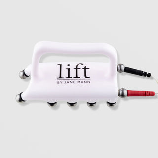 Lift by Jane Mann microcurrent sculpting probe white handheld device with silver ball electrodes and red black connector cables on grey background