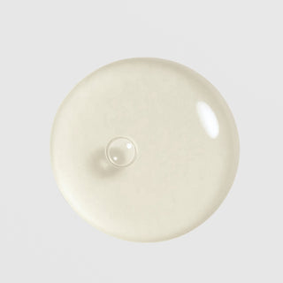 Circadia Cyto-Comm Revitalizing Serum texture swatch showing lightweight glossy gel drop with a soft ivory tone
