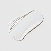 Colorescience Total Protection No-Show Mineral Body Shield SPF 50 white cream texture swatch on a light gray background