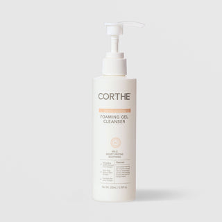 Corthe Dermo Essential Foaming Gel Cleanser in a white pump bottle, 200 ml / 6.76 fl oz, mild moisturizing and soothing formula for all skin types, on a light gray background