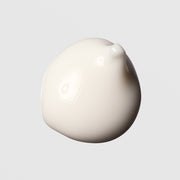 Face Reality Brighten-C Mask texture swatch – thick creamy white formula on light gray background