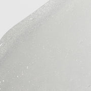 Close-up of Hale & Hush Refine Polish showing a clear gel exfoliant texture with fine white exfoliating particles on a light gray background