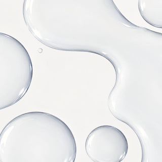 Clear, watery gel texture droplets of iS Clinical Daily Active Smoothing Toner