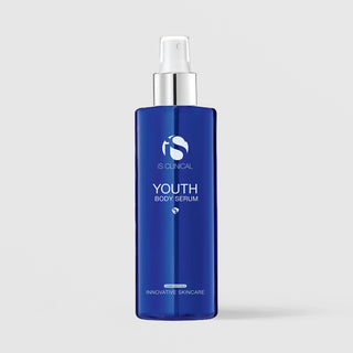 iS Clinical Youth Body Serum in a cobalt blue bottle with silver pump on a light gray background