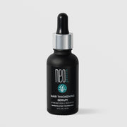 NeoGenesis Hair Thickening Serum Strengthen and Nourish 30 mL in a matte black glass dropper bottle with chrome silver collar and teal hair follicle icon label on a light gray background