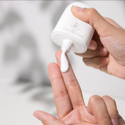 Pfect-a Solar Elixir sunscreen being dispensed onto hands