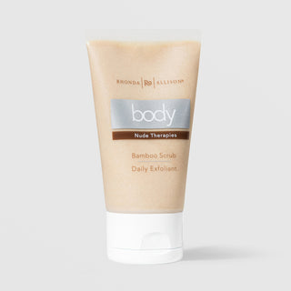 Rhonda Allison Body Nude Therapies Bamboo Scrub Daily Exfoliant in a 2oz beige squeeze tube with white cap on a light gray background