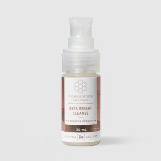 Rhonda Allison Pigmentation Solutions Beta Bright Cleanse PIH Redness Reduction cleanser in a 30mL pump bottle with mauve and rose label on a light gray background