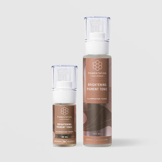 Rhonda Allison Pigmentation Solutions Brightening Pigment Tonic Illuminating Toner shown in both sizes: 30mL and 120mL pump bottles with clear caps and warm brown honeycomb labels on a light gray background
