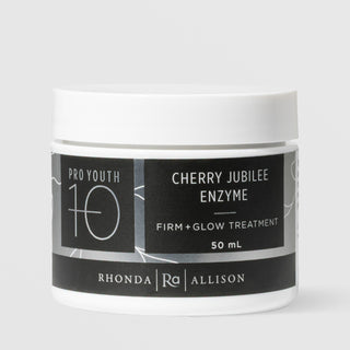 Rhonda Allison Pro Youth 10 Cherry Jubilee Enzyme Firm and Glow Treatment mask in a 50mL white wide-mouth jar with white lid and black botanical label on a light gray background