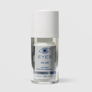 Rhonda Allison Eyes Eye Lift Instant Firming Renewal eye cream in a 15mL clear airless pump bottle with white cap and silver and navy blue label on a light gray background