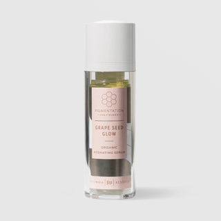 Rhonda Allison Pigmentation Solutions Grape Seed Glow Organic Hydrating Serum in a 30mL clear airless pump bottle with white cap and blush pink label on a light gray background
