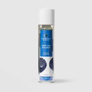 Rhonda Allison Compromised Barrier Grape Seed Replenish Organic Hydration serum in a 50mL clear airless pump bottle with white cap and cobalt blue botanical label on a light gray background
