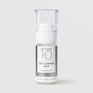 Rhonda Allison Pro Youth 10 Luxe Cleansing Balm Lavender Silk cleanser in a 30mL clear pump bottle with clear cap and silver botanical label on a light gray background