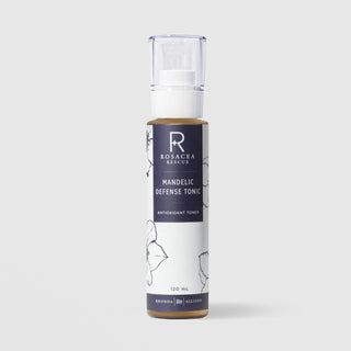 Rhonda Allison Rosacea Rescue Mandelic Defense Tonic Antioxidant Toner 120 mL in a clear pump bottle with white cap and navy blue floral label on a light gray background