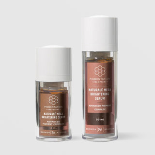 Rhonda Allison Pigmentation Solutions Naturale Mega Brightening Serum Advanced Pigment Complex in two sizes: 15 mL travel size and 30 mL full size, shown side by side in clear airless pump bottles with white caps and warm terracotta honeycomb patterned labels on a light gray background
