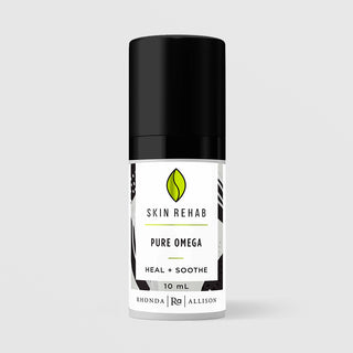 Rhonda Allison Skin Rehab Pure Omega Heal and Soothe 10 mL in a white airless pump bottle with glossy black cap and black and white graphic patterned label on a light gray background