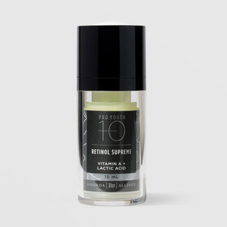 Rhonda Allison Pro Youth 10 Retinol Supreme Vitamin A and Lactic Acid 15 mL in a clear airless pump bottle with glossy black cap showing pale green formula inside and a black botanical label on a light gray background
