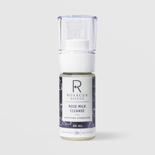 Rhonda Allison Rosacea Rescue Rose Milk Cleanse Soothing Hydration 30 mL travel size in a white pump bottle with navy blue rose floral patterned label on a light gray background