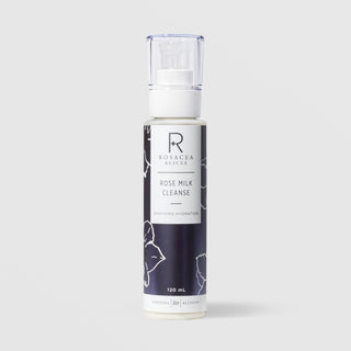 Rhonda Allison Rosacea Rescue Rose Milk Cleanse Soothing Hydration 120 mL in a white pump bottle with navy blue rose floral patterned label on a light gray background