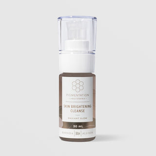 Rhonda Allison Pigmentation Solutions Skin Brightening Cleanse Radiant Glow 30 mL travel size in a clear pump bottle with white pump head and mocha brown abstract patterned label on a light gray background