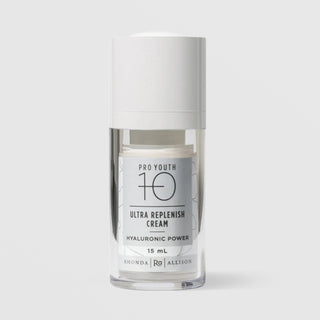 Rhonda Allison Pro Youth 10 Ultra Replenish Cream Hyaluronic Power 15 mL travel size in a clear airless pump bottle with white cap and silver gray botanical label on a light gray background