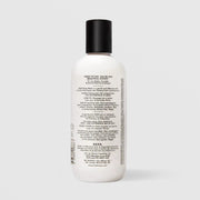 Back of SEEN Fragrance Free Body Wash bottle showing usage instructions, ingredient claims, and bilingual English and French text, against a light gray background