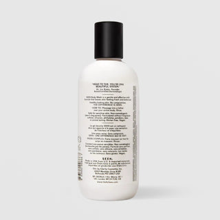 Back of SEEN Fragrance Free Body Wash bottle showing usage instructions, ingredient claims, and bilingual English and French text, against a light gray background