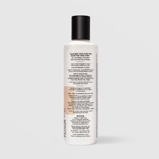 Back of SEEN Scented Conditioner bottle showing usage instructions, ingredient claims, and bilingual English and French text, against a light gray background.