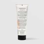 Back of SEEN Deeper Conditioner tube showing usage instructions, ingredient claims, and bilingual English and French text, against a light gray background.