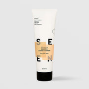 SEEN Skin-Caring Deeper Conditioner (8.5 fl oz) in a white squeeze tube with a black cap and bold SEEN lettering accented by warm tan color blocks, labeled dermatologist designed and formulated for drier hair types, displayed against a light gray background.