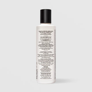 Back of SEEN Fragrance Free Shampoo bottle showing usage instructions, ingredient claims, and bilingual English and French text, against a light gray background.