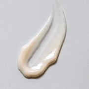 Skin Script Tri-Peptide Eye Cream texture swatch showing rich creamy white formula with warm ivory tones and smooth luxurious consistency. Available at Art of Skin Care