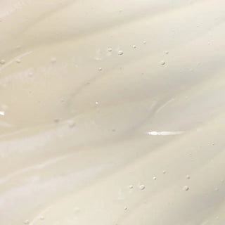 Kizo Lab UV Defense Clear Sunscreen SPF 50 close-up cream texture showing smooth spreadable off-white lotion consistency with micro-bubbles
