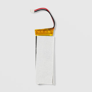 Time Master Pro replacement lithium polymer battery silver rectangular cell with yellow tip and red black connector wires on grey background