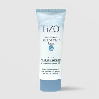 Claude responded: TiZO Mineral Sun Defense Tinted SPF 50 daily mineral sunscreen 50g in light blue squeeze tube with antioxidants C and ETiZO Mineral Sun Defense Tinted SPF 50 daily mineral sunscreen 50g in light blue squeeze tube with antioxidants C and E